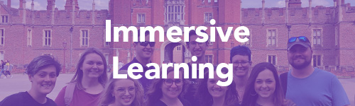 group of students in front of castle